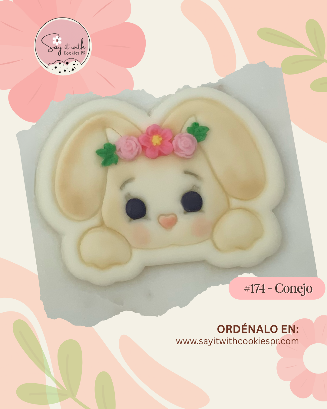 Cookie shaped like a rabbit with floral decorations.