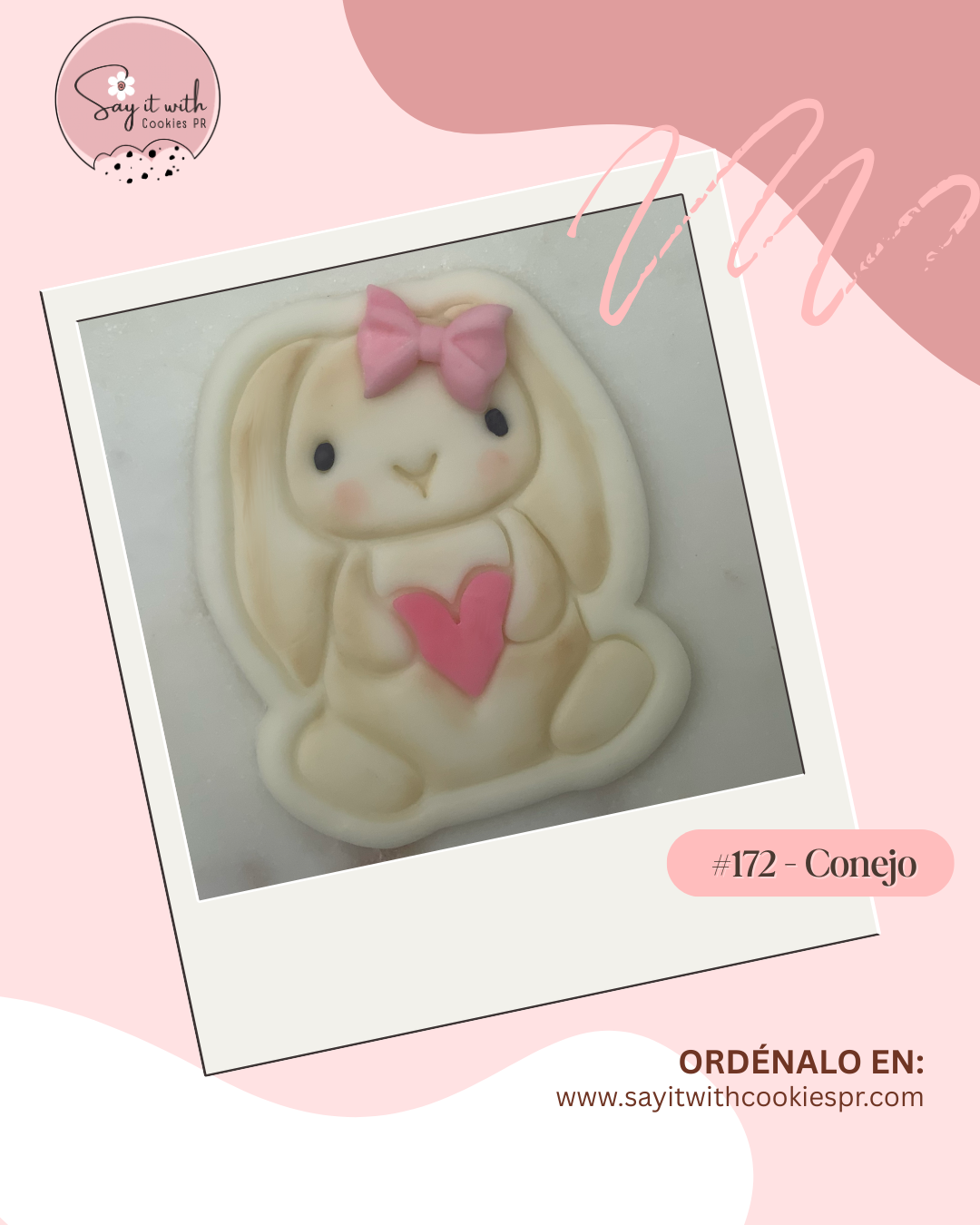 Cookie mold shaped like a bunny with a pink bow and heart.